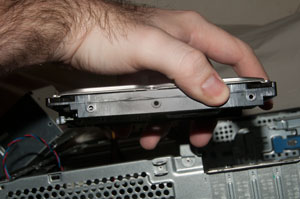 Holes that you secure the hard drive with by screwing it in