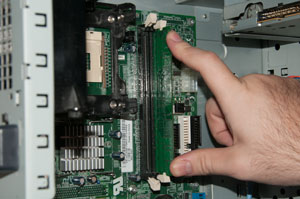 RAM chip fully secured in motherboard