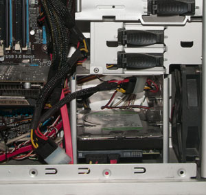 Close-up of bottom-right corner of computer with hard drive inside